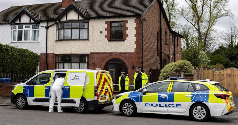 Police and forensics at a crime scene.