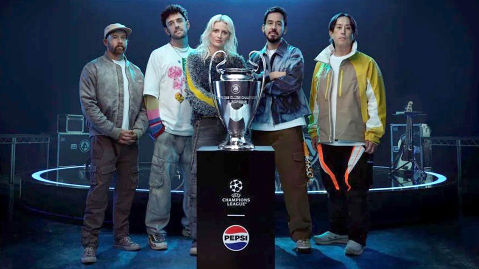 Linkin Park with the UEFA Champions League trophy and Pepsi.