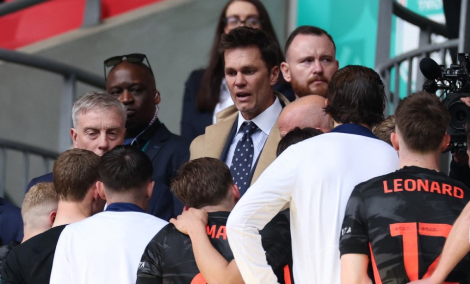 Soccer Football - EFL Trophy Final - Birmingham City v Peterborough United - Wembley Stadium, London, Britain - April 13, 2025 Birmingham City minority owner Tom Brady and owner Tom Wagner speak to the players before they collect their runners up medals Action Images via Reuters/John Sibley