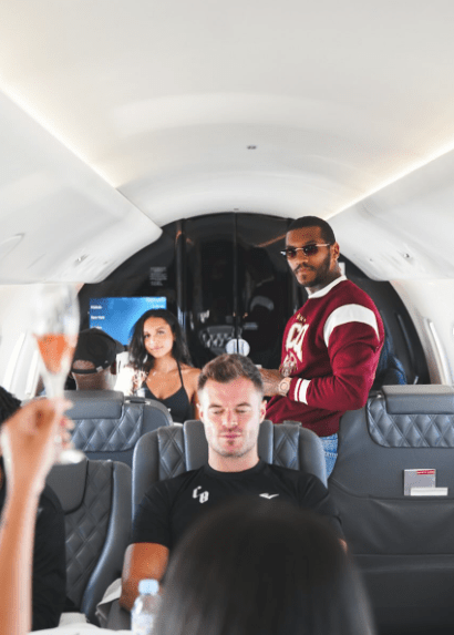 People celebrating on a private jet.