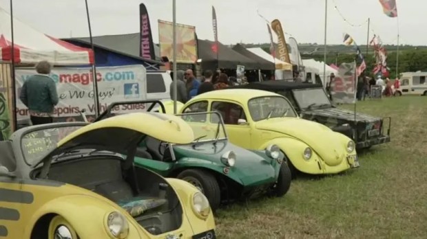 Several vintage Volkswagen Beetles and other classic cars on display at the Run To The Sun Festival.