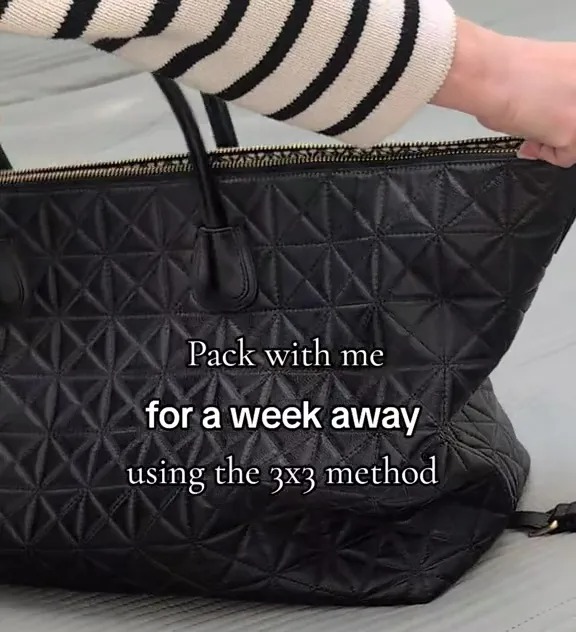 Packing a week's worth of outfits into a carry-on bag using the 3x3 method.