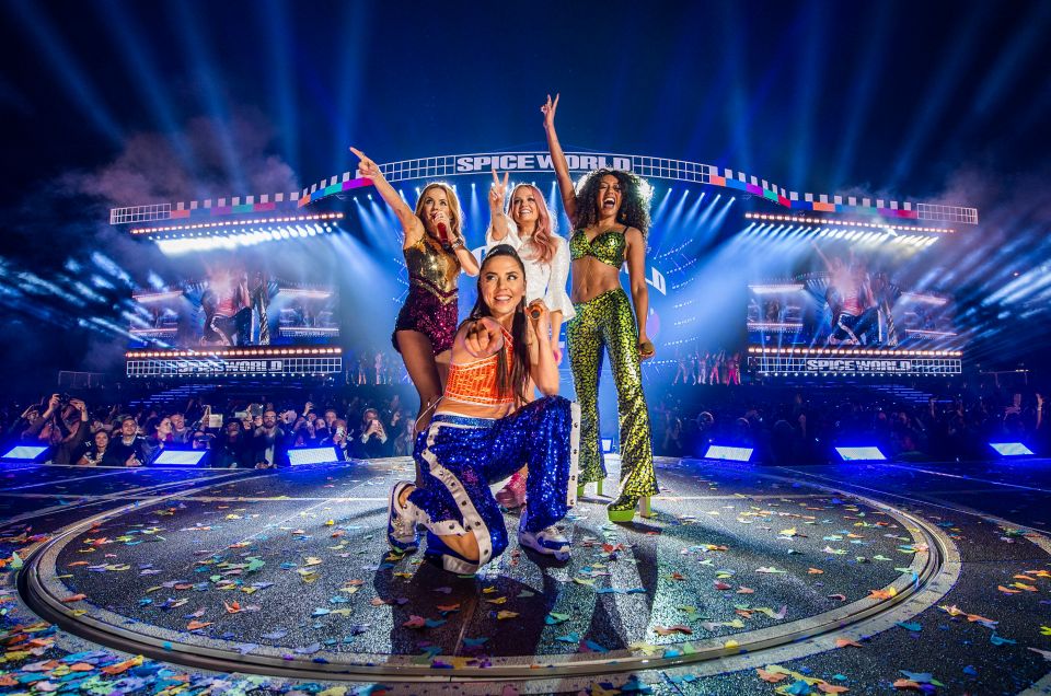 The Spice Girls performing on stage.