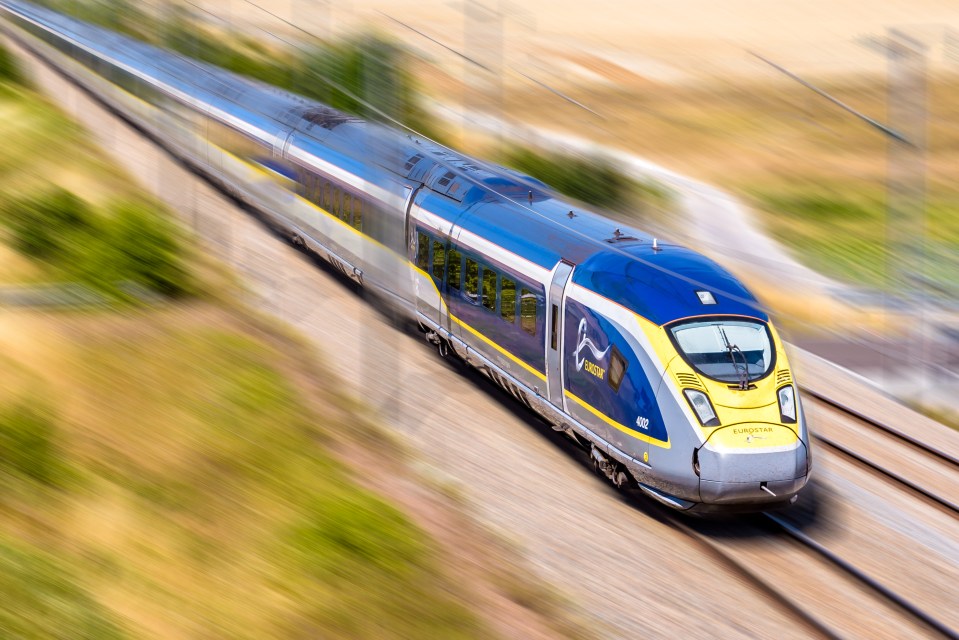High-speed Eurostar train traveling through the French countryside.