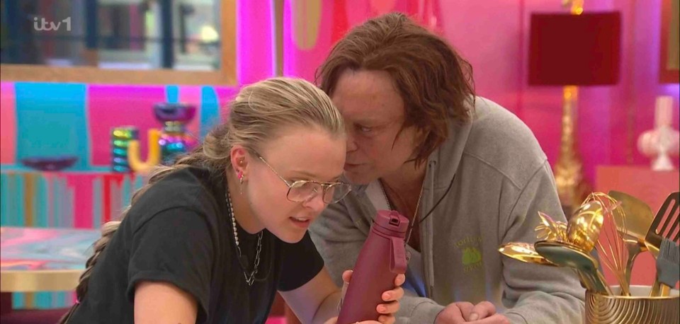 Screenshot of two people whispering, one asking "Where's the cigarette room?"
