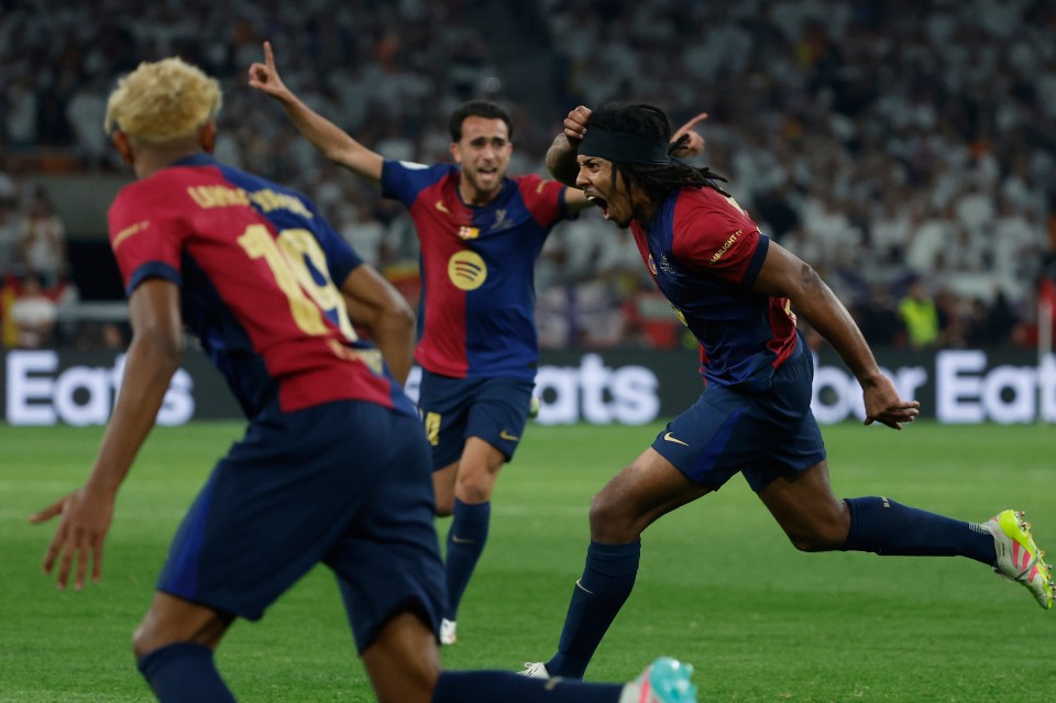 Jules Kounde celebrating a goal during a soccer match.