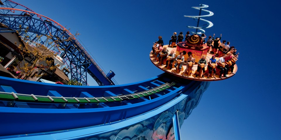 People riding a roller coaster at Blackpool Pleasure Beach.
