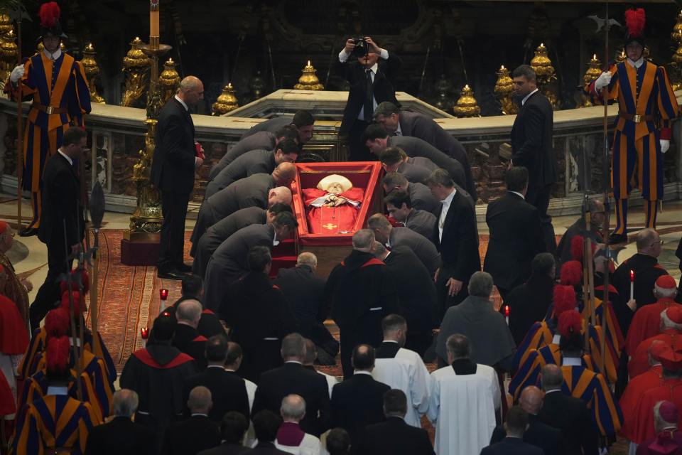 Pope Francis's body being carried into St. Peter's Basilica.