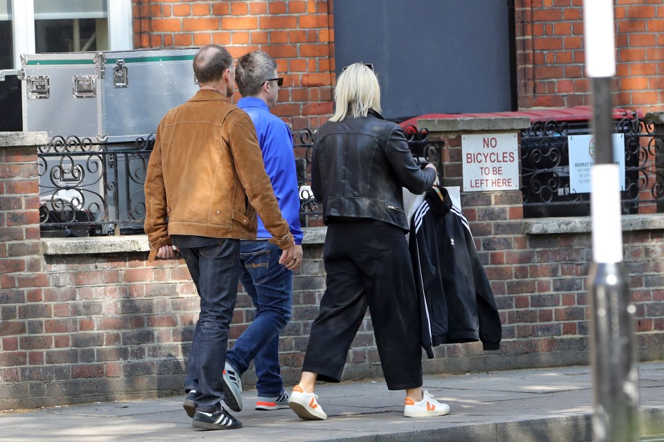 Noel Gallagher leaving a studio after a photoshoot with his brother Liam.