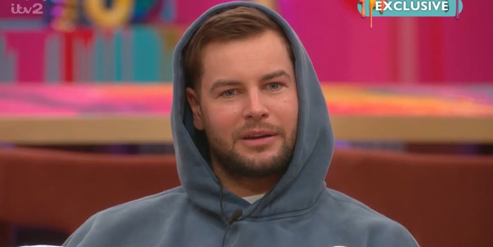 Chris Hughes in a blue hoodie.