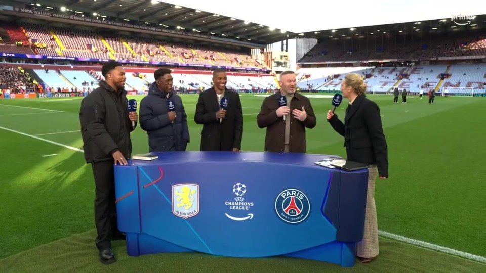 Four soccer analysts and a host at a Champions League match.