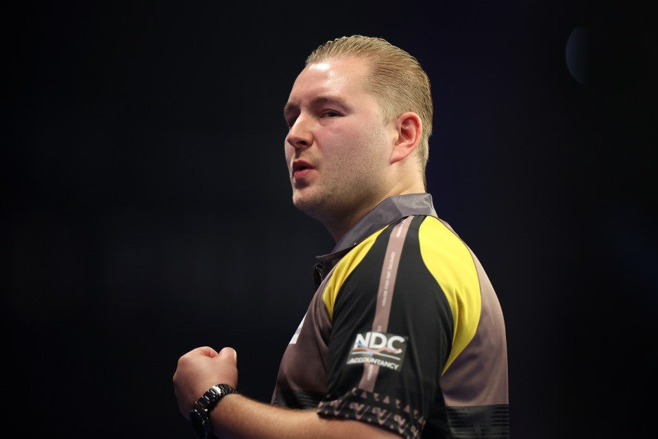 Dimitri Van den Bergh of Belgium reacting during a darts match.
