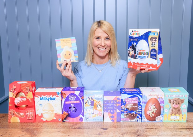 Woman holding various Easter eggs.