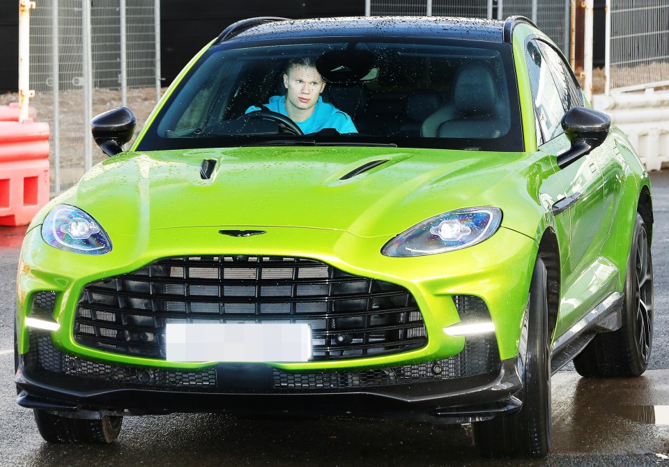 Erling Haaland in a lime green Aston Martin DBX 707.