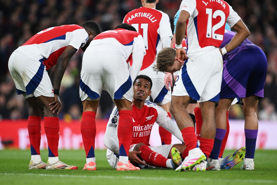 Arsenal's Gabriel Magalhaes on the ground after an injury.