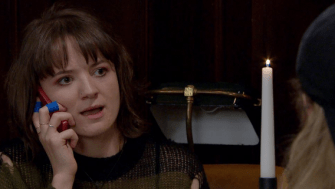 Gail Loman on a phone call in Emmerdale.
