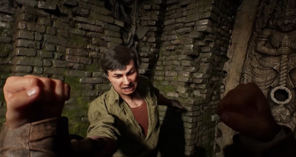 Gaming screenshot of a man fighting in a dark, stone room.