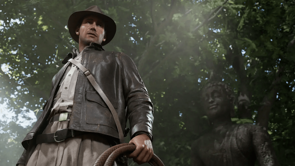 A video game character, Indiana Jones, holding a whip in a jungle setting.