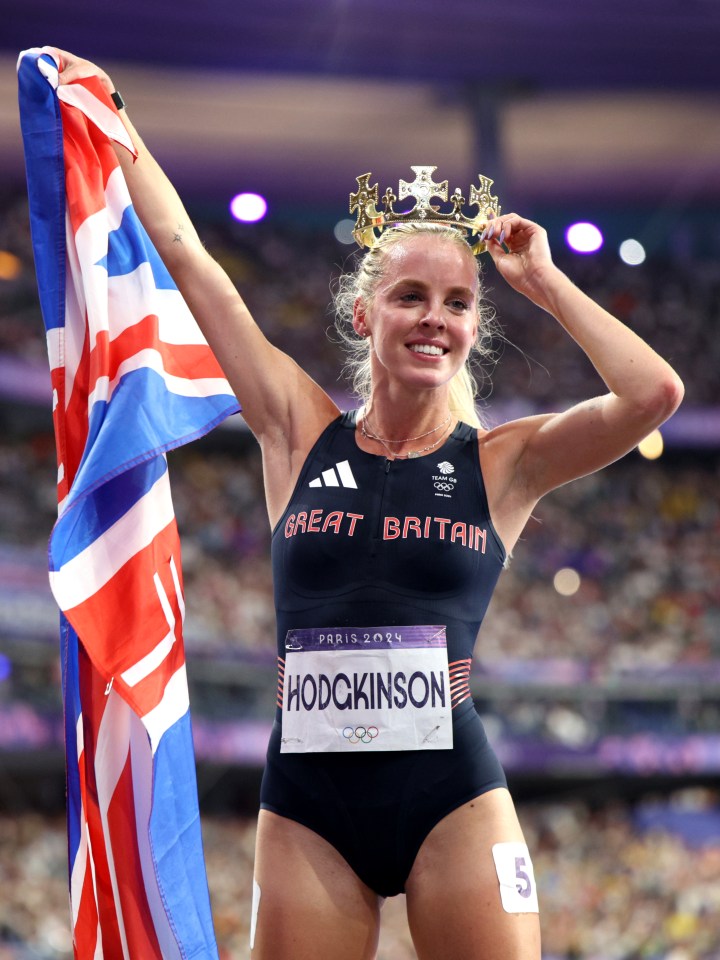 Keely Hodgkinson, gold medalist, holding a British flag and a crown.