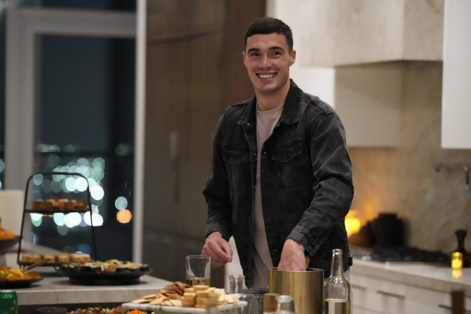 Lloyd Jones in a kitchen at a party.