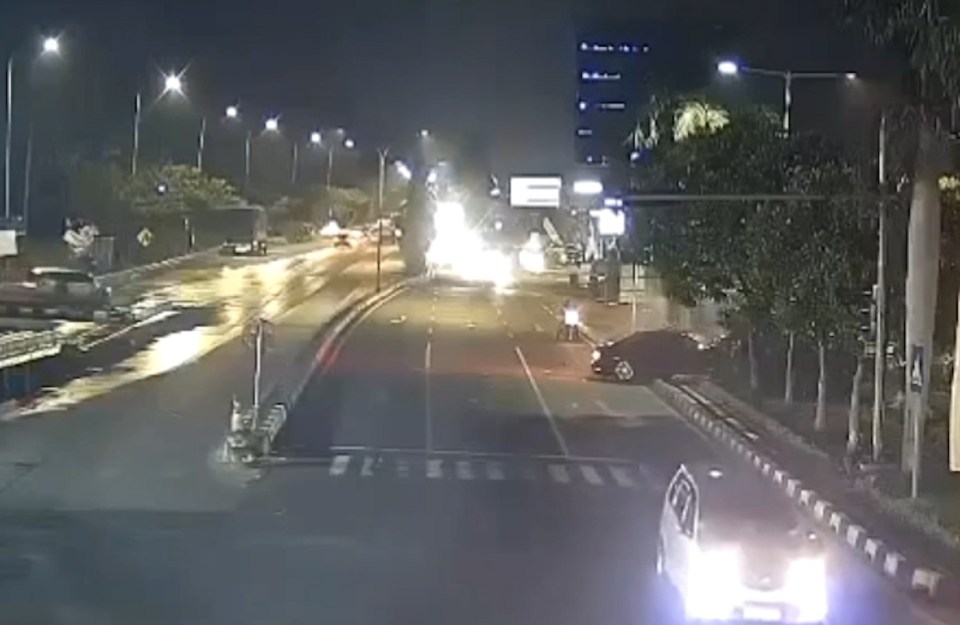 CCTV footage of a car falling from an unfinished bridge at night.