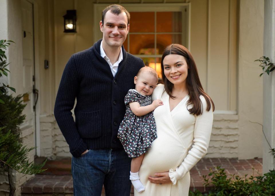 Cooper Hefner, his wife Scarlett Byrne, and their daughter.  Scarlett is pregnant.