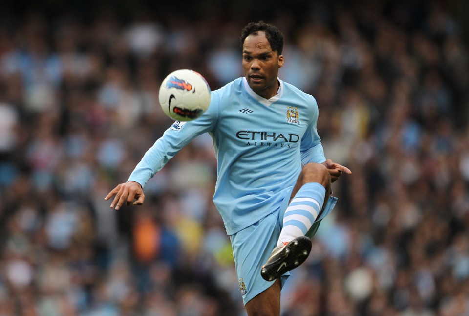Joleon Lescott, Manchester City soccer player, kicking a ball.