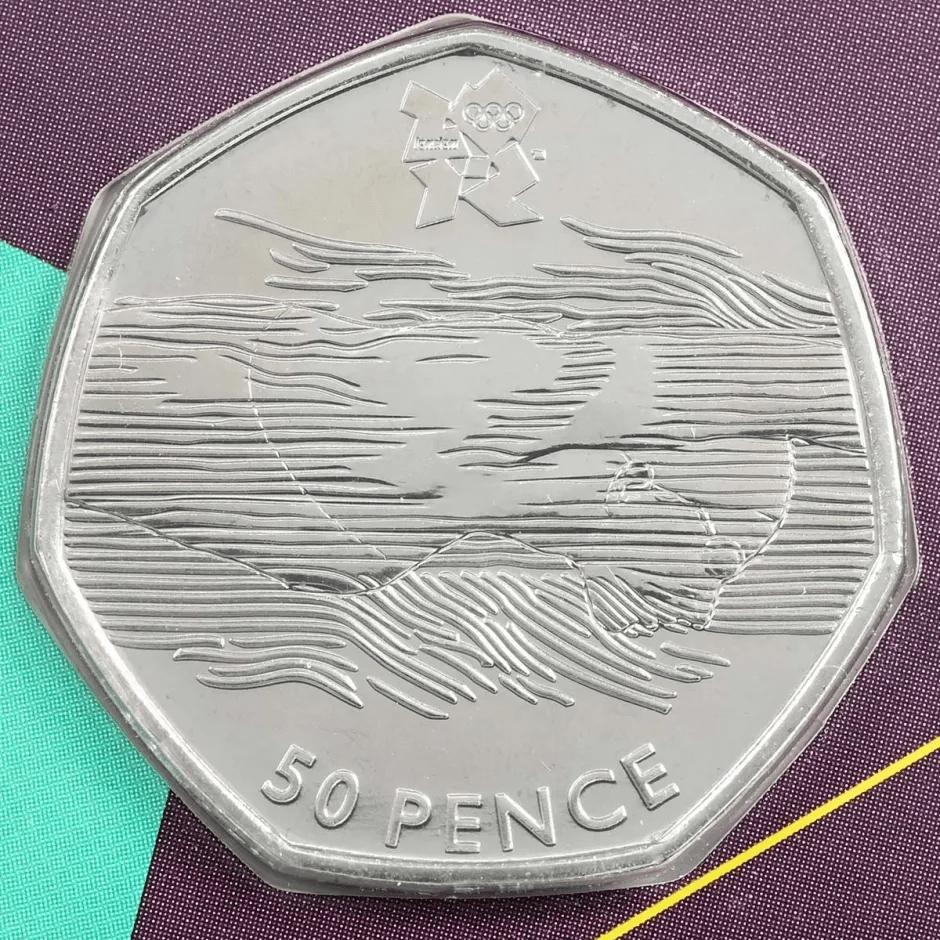 Fifty pence coin depicting a swimmer and the London 2012 Olympic logo.