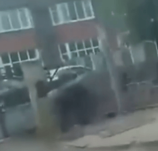 Blurry image of a car parked on a residential street.
