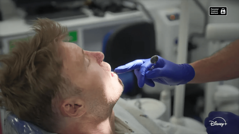 A man receiving a dental examination.