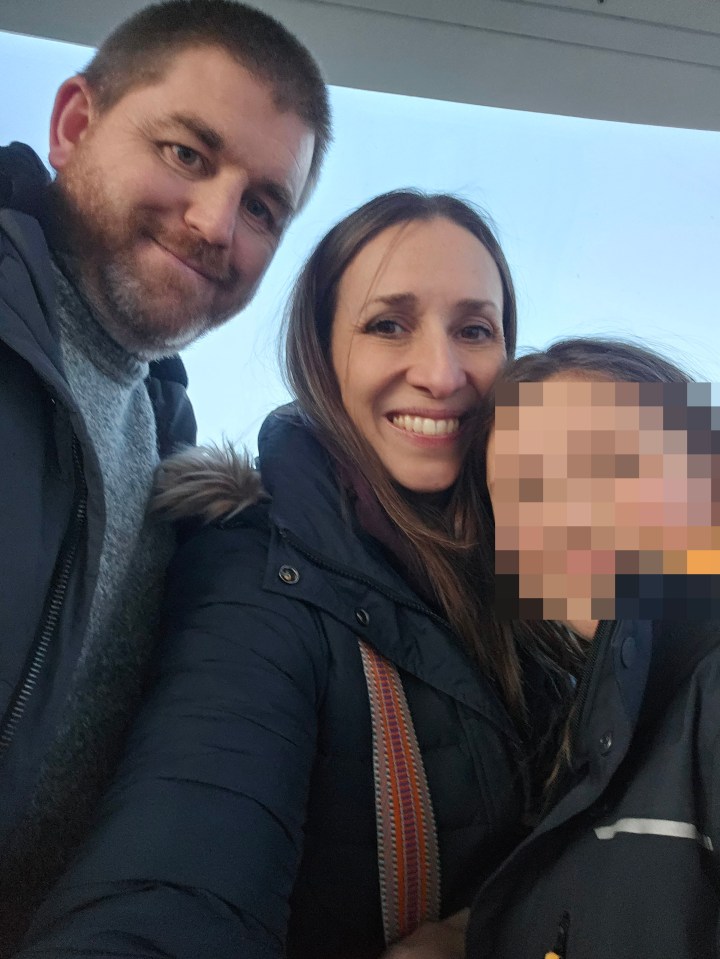 Photo of Kate Greenhalgh, her husband John, and their daughter.