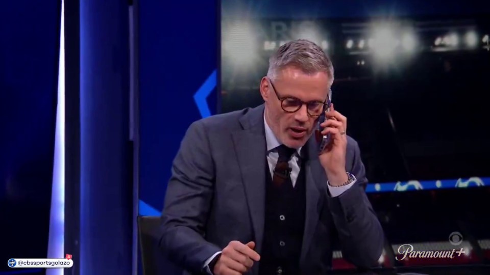 Jamie Carragher on a phone call during a TV broadcast.