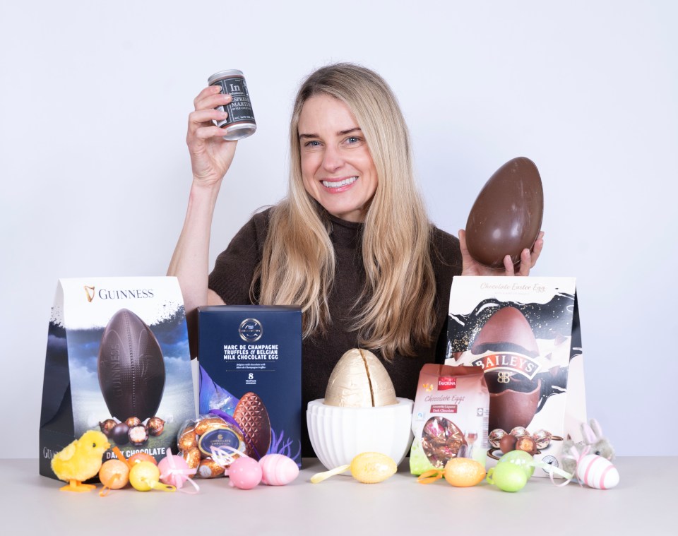 Woman holding alcoholic Easter eggs and drinks.