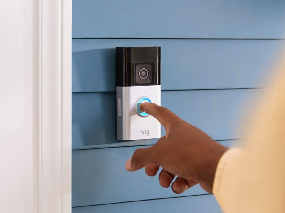 Person using a Ring doorbell.