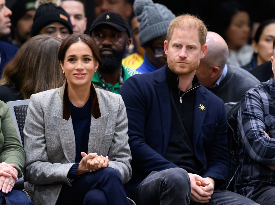 Meghan, Duchess of Sussex, and Prince Harry at a wheelchair basketball match.