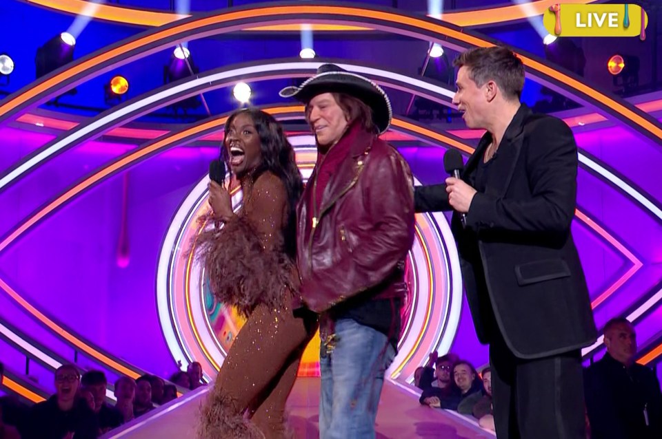 Mickey Rourke, AJ Odudu, and a host on a game show.