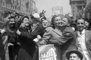 An image collage containing 1 images, Image 1 shows World War II Victory Day celebration, people embracing, newspaper headline "Nazis Quit" visible