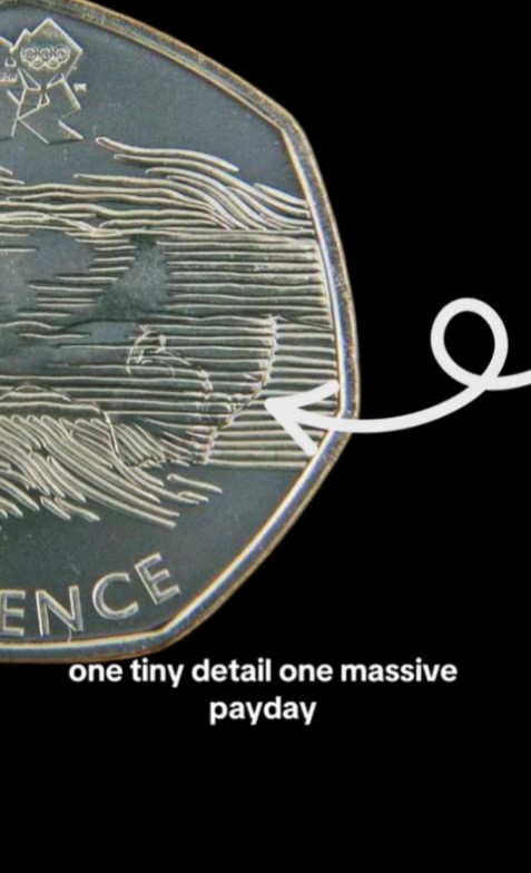 Close-up of an Olympic Aquatics 50p coin with a minting error.