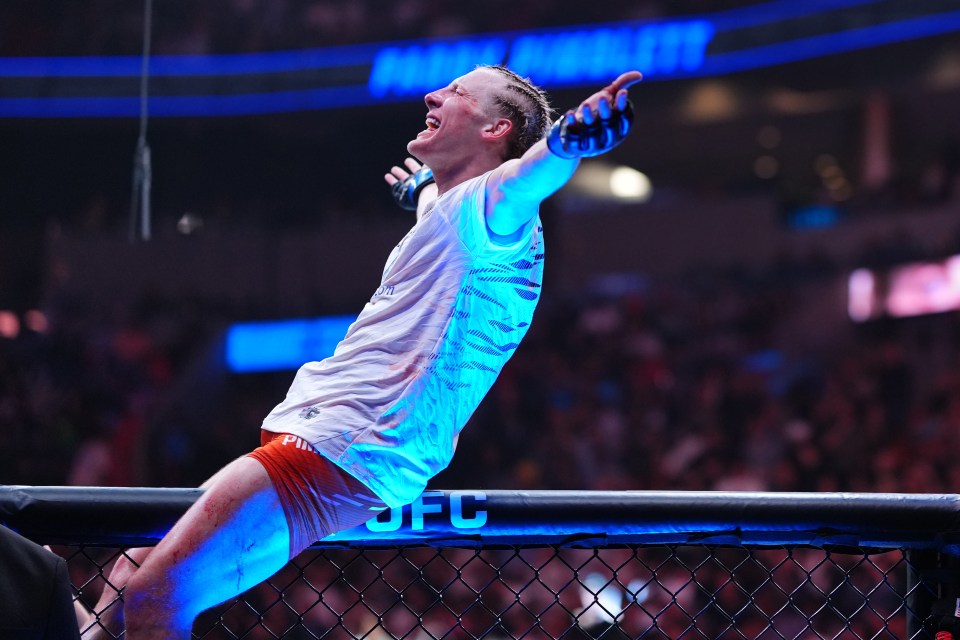 Paddy Pimblett celebrates a TKO victory in a UFC match.