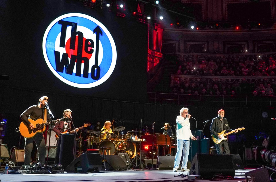 Pete Townshend and Roger Daltrey of The Who performing on stage.