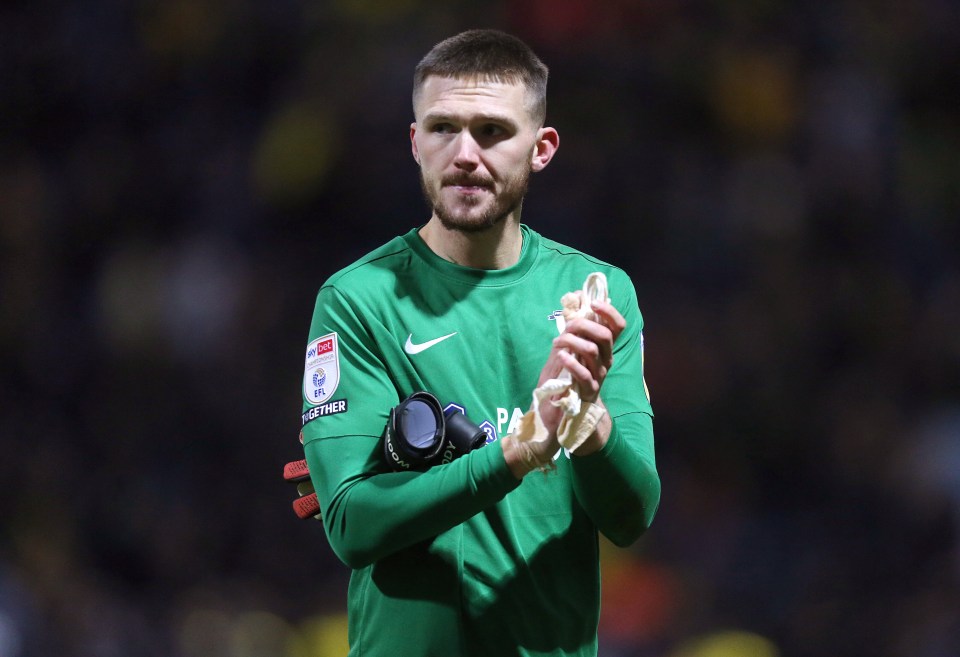 Preston North End's Freddie Woodman applauds fans after a soccer match.