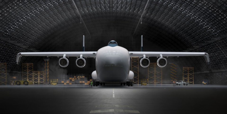 Illustration of a large cargo plane in a hangar.