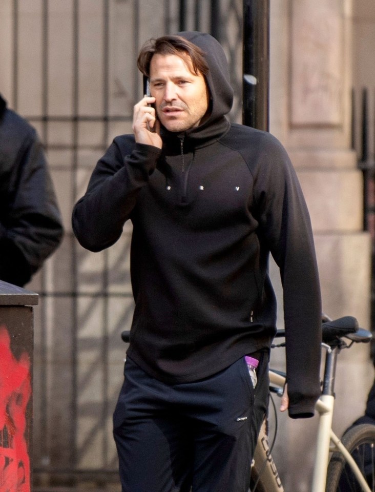 Mark Wright on a phone call, walking in London.
