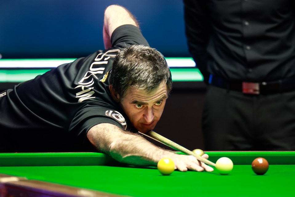 Ronnie O'Sullivan playing snooker.