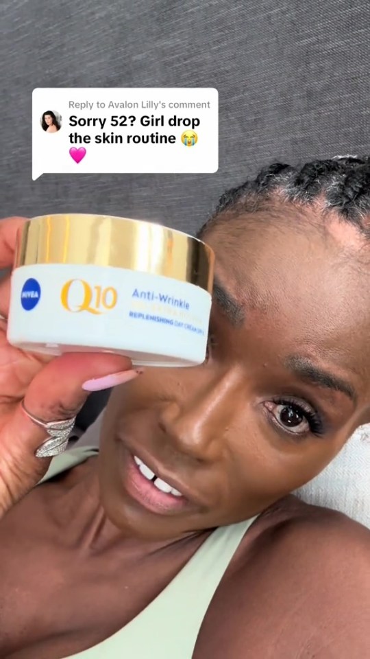 Woman holding jar of Nivea Q10 Anti-Wrinkle cream.