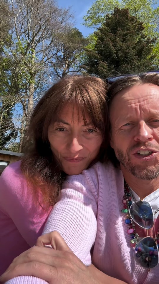 Close-up of a couple embracing outdoors.