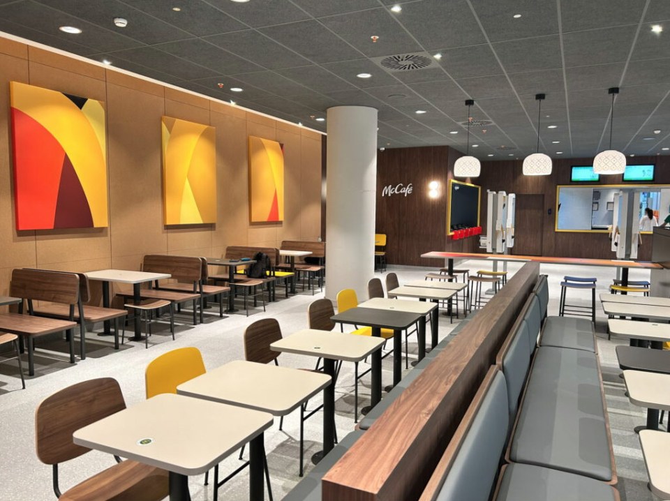 Interior of a large McDonald's restaurant at an airport.