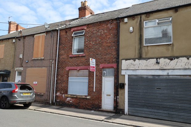 A three-bed home for sale at auction; the property needs refurbishment.