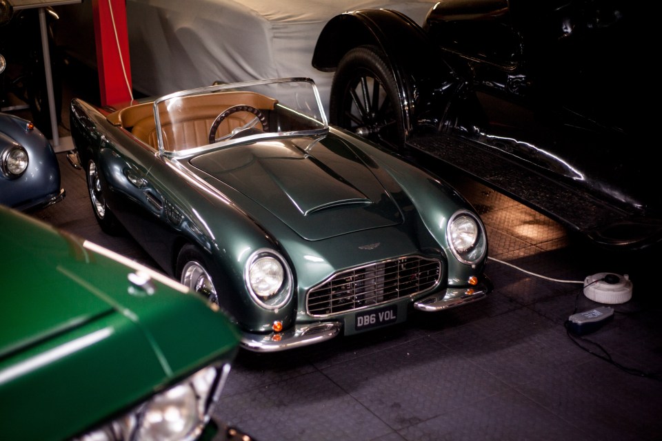 Miniature Aston Martin DB6 Volante in a classic car collection.