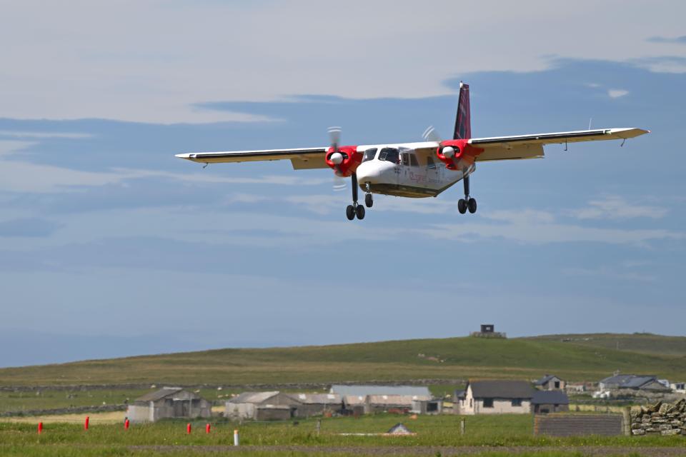 Logan Air plane landing.